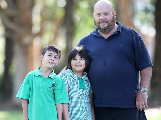 Michael Lambert with children Cole, nine, and Kaitlyn, eight, who has severe epilepsy, Picture: Sue Graham