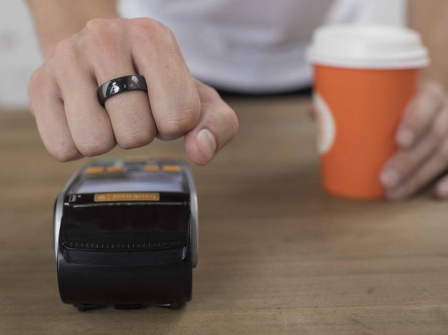 A Bankwest customer using a Halo ring to pay for a coffee. Picture: Supplied.