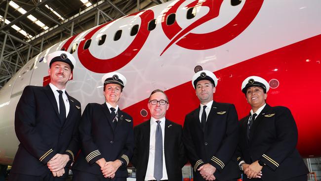 Qantas Group CEO, Alan Joyce poses with flight deck crew during the Qantas celebration of the arrival of London To Sydney direct flight and centenary event. Picture: Getty Images