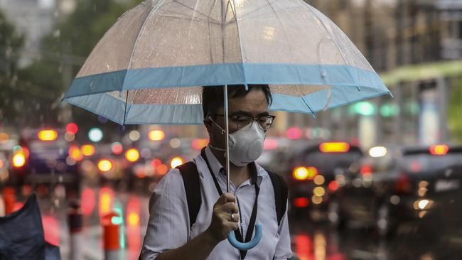 Commuters were plagues by haze, then rain. Picture: Wayne Taylor