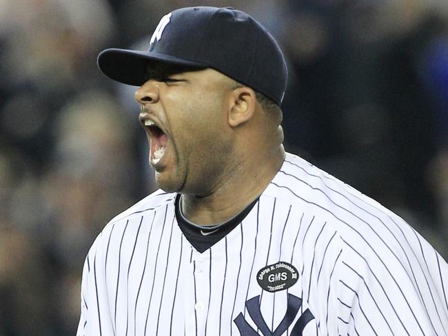 New York Yankees starting pitcher CC Sabathia reacts after striking out Texas Rangers' Mitch Moreland to end the top of the sixth inning in Game 5 of baseball's American League Championship Series Wednesday, Oct. 20, 2010, in New York. (AP Photo/Charles Krupa)