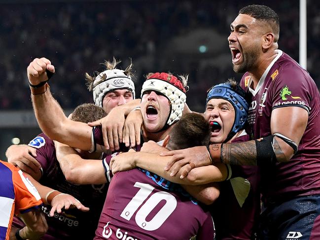 The Reds celebrate James O'Connor’s match-winning try against the Brumbies. Picture: Bradley Kanaris/Getty Images