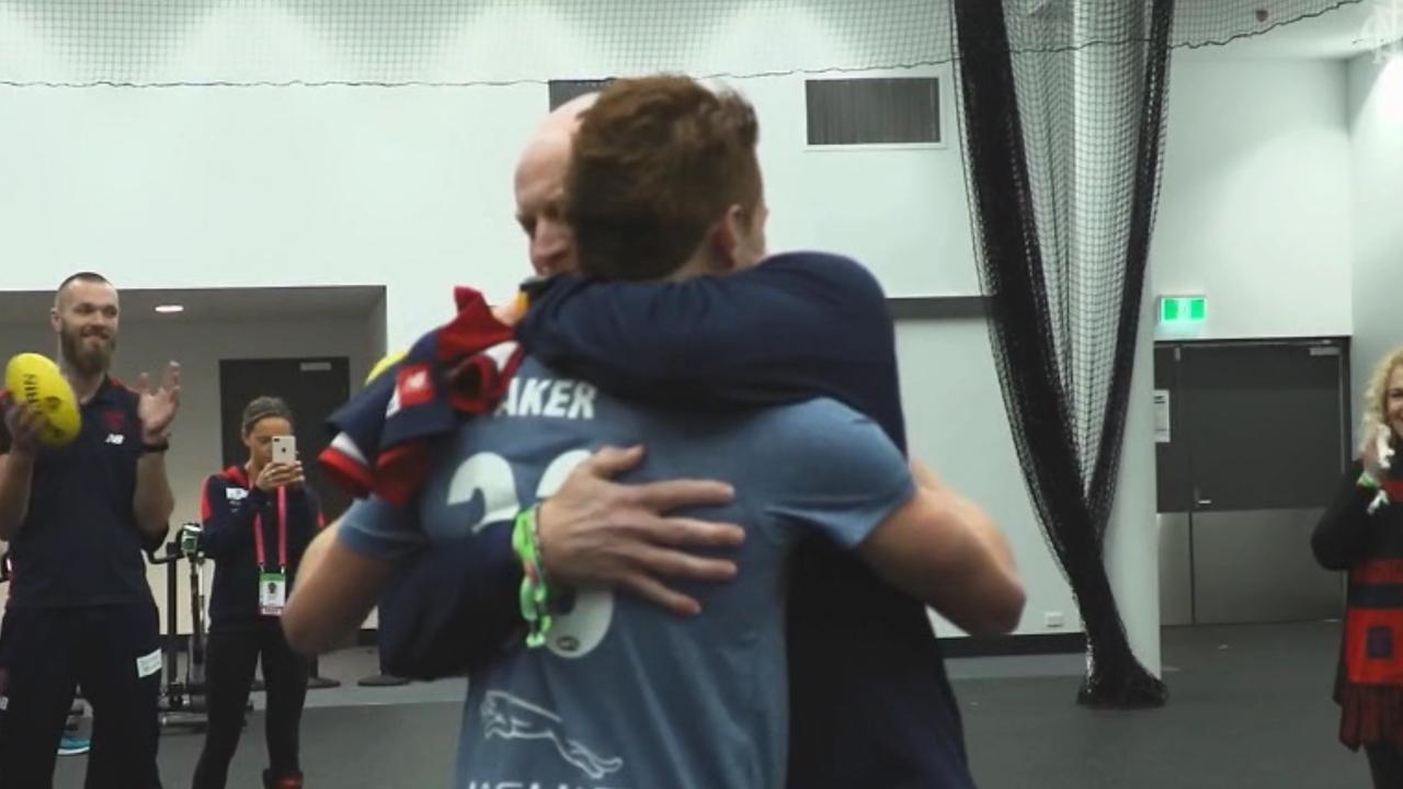 Lee Baker presents son Oskar with his Melbourne jumper.