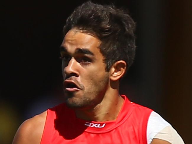 GOLD COAST, AUSTRALIA - AUGUST 31: Jack Martin of the Suns runs the ball during the round 23 AFL match between the Gold Coast Suns and the West Coast Eagles at Metricon Stadium on August 31, 2014 in Gold Coast, Australia. (Photo by Chris Hyde/Getty Images)
