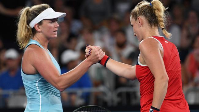 Coco Vandeweghe shakes hands with Timea Babos after a fiery match. Picture: AFP Photo