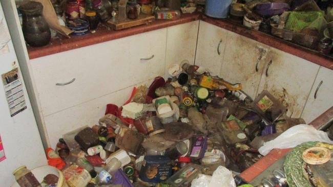 A filthy kitchen where years worth of used food containers, rubbish and dirty plates have been dumped and forgotten. Picture: O'Shea’s