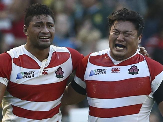 Japan's Amanaki Mafi (L) and Hiroshi Yamashita in tears after the incredible win.