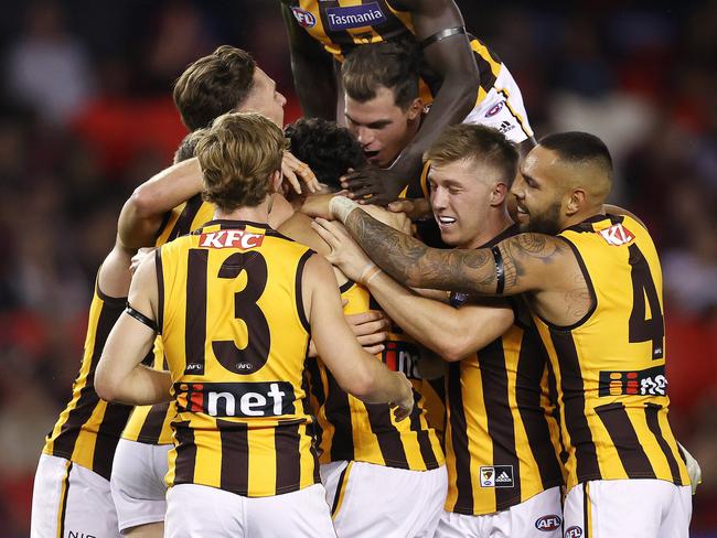 AFL Round 1. 20/03/2021.Essendon v Hawthorn at the Marvel Stadium, Melbourne.   Tyler Brockman of the Hawks celebrates his goal in the first quarter  with teammates . Pic: Michael Klein