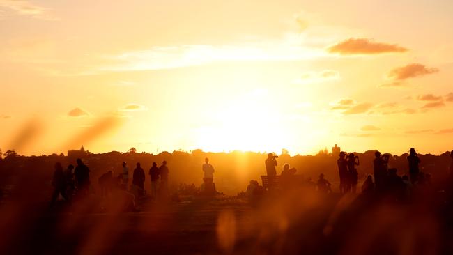 JANUARY 5, 2024: People watch the sun set at Dudley Page Reserve in Dover Heights .Picture: Damian Shaw