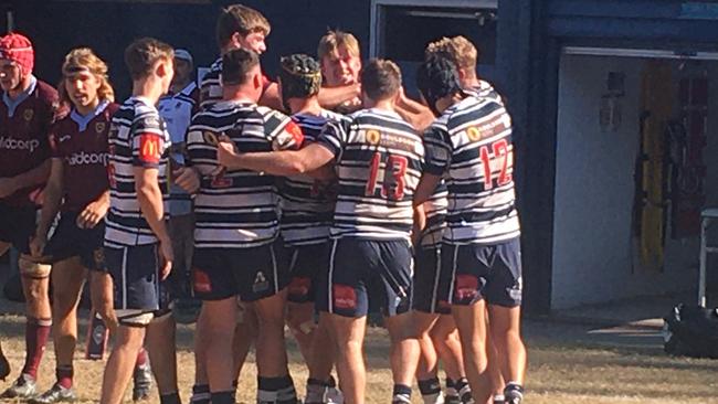 Brothers celebrate Louis Werchon's match winning try.