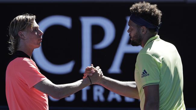 Canada's Denis Shapovalov, left, congratulates Jo-Wilfried Tsonga. Picture: AP