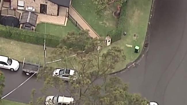 Police tape outside the Davidson house where the bodies of a man, woman, boy and girl - and the family dog - were found. Picture: Channel 7