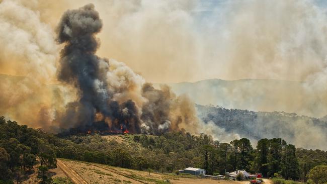 Fire threatens a property. Picture: Timothy Dean