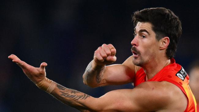 MELBOURNE, AUSTRALIA - JULY 06: Alex Sexton of the Suns handballs during the round 17 AFL match between North Melbourne Kangaroos and Gold Coast Suns at Marvel Stadium, on July 06, 2024, in Melbourne, Australia. (Photo by Morgan Hancock/AFL Photos/via Getty Images)