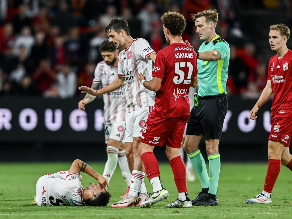 Dylan Scicluna (left) goes down after suffering a serious knee injury at Coopers Stadium. Picture: Mark Brake/Getty Images