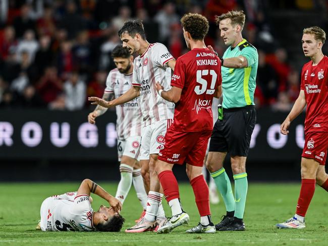 Dylan Scicluna (left) goes down after suffering a serious knee injury at Coopers Stadium. Picture: Mark Brake/Getty Images