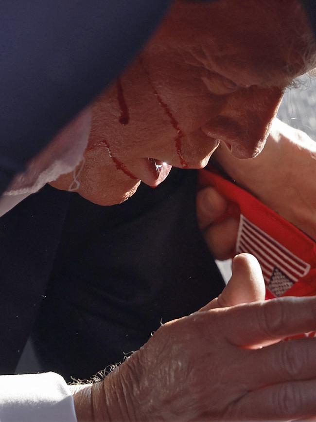 Secret Service personnel dived on the former President. Picture: Anna Moneymaker/Getty Images/AFP