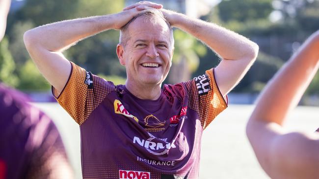 Busted ass: Bill Shorten runs wild with the Broncos in happier times. Picture: AAP