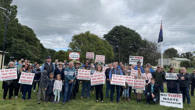 Wendy Tuckerman, and representatives of Goulburn Mulwaree Council previously holding up signs with the community of Tarago, in opposition of the Veolia energy-from-waste incinerator. Picture: Niki Iliagoueva