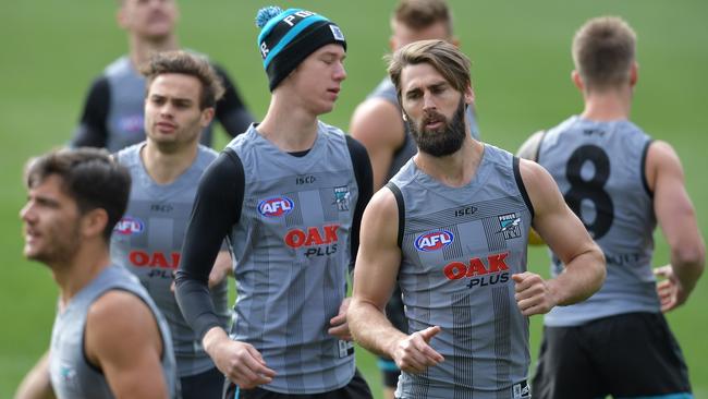 Port Adelaide Power players Todd Marshall (beanie) and Justin Westhoff at training on Friday.