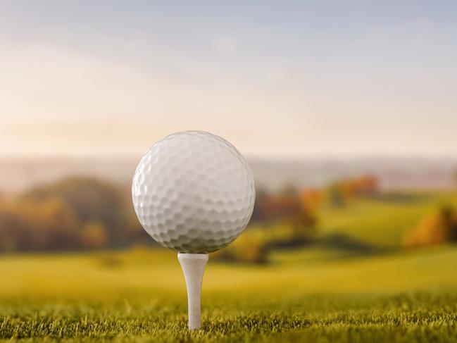 Close up of a golf ball at the golf course tee with copy space - picture istock