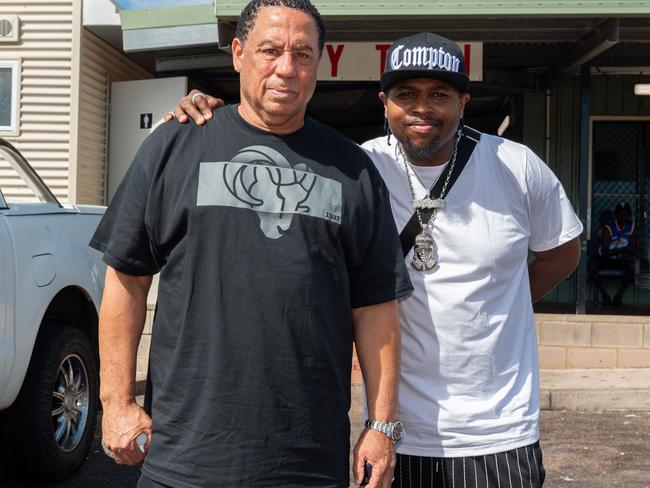 Classic member of pioneering Compton gangsta rap group NWA, DJ Yella, with the son of late band member Eazy-E, Lil Eazy-E, ahead of their performance in Darwin on Friday. Picture: Pema Tamang Pakhrin