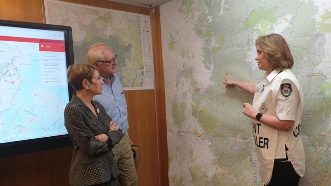 RFS incident controller Superintendent Karen Hodges (right) discusses the Gospers fire with NSW Governor Margaret Beazley and her husband Dennis Wilson during a visit to the region on January 8. Picture: Isabell Petrinic