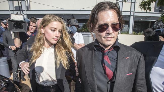 Johnny Depp and wife Amber Heard leave court in Queensland in 2016.