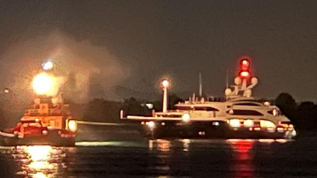 A tugboat rescues Clive Palmer's $40m superyacht Australia after it got stuck on a sandbank on the Gold Coast on Thursday. Picture: Keith Woods.