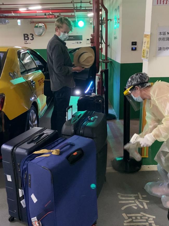 Hotel staff spray disinfectant over luggage and shoes in the basement. Picture: Supplied