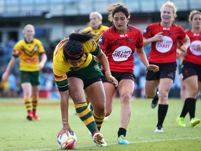 Vanessa Foliaki scores one of Australia’s 18 tries against Canada.