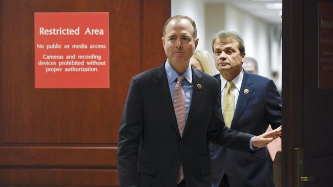 Adam Schiff, followed by Democrat representative Mike Quigley leaves the closed hearing room on Thursday. Picture: AP