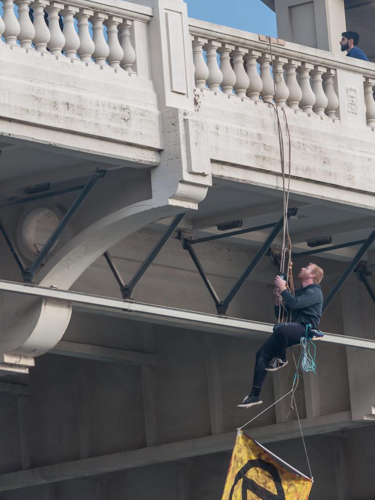 Extinction Rebellion protester abseiling William Jolly Bridge. 19 August 2019. Picture: Supplied.