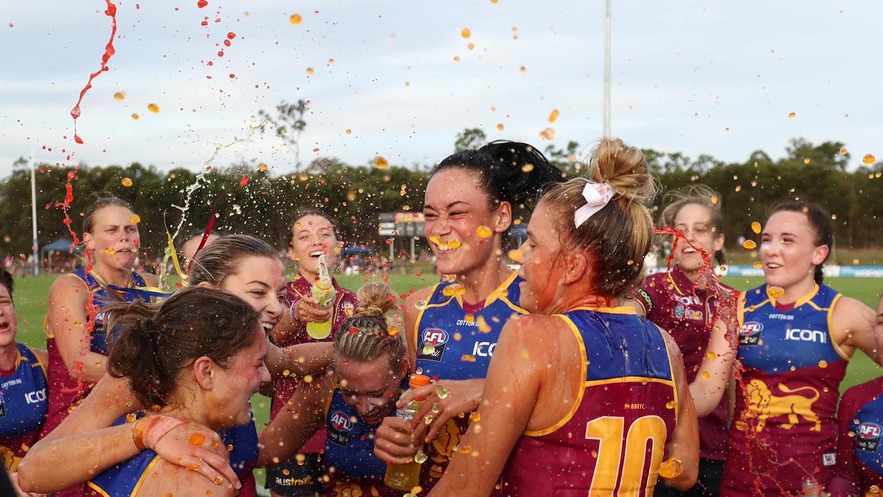 Lions celebrate winning the round one AFLW match against GWS Giants.