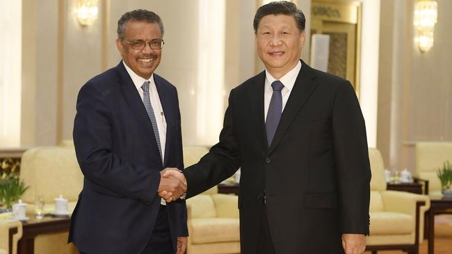 World Health Organisation director general Tedros Adhanom shakes hands with Chinese President Xi Jinping in January. Picture: AFP