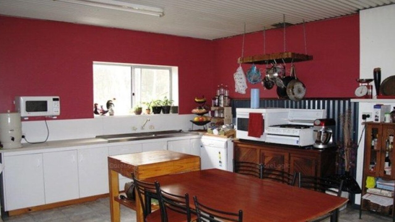 A kitchen in one of the residences on the property, pictured before the Miles’ bought the property.