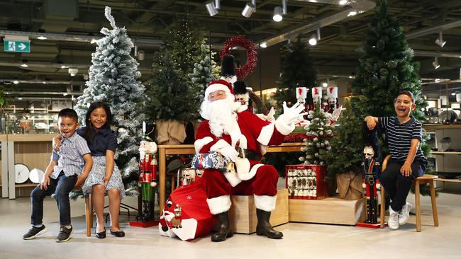 Santa paid an early, socially-distanced visit to David Jones and caught up with Jacob and Zoe Hipolito (left) and Matthew Nader (right). Picture: Sam Ruttyn