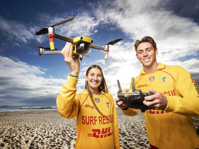 New drones, funded by Gold Coast Airport, to be unleashed in drowning blackspots on Tweed Coast beaches.L-R: Life savers Chloe Jones and Angus Macphail from Cudgen Headland SLSC with a drone funded by Gold Coast Airport.Picture: NIGEL HALLETT