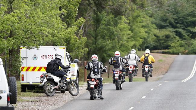 Search crews on motorcycles on Saturday. Picture: Tim Hunter