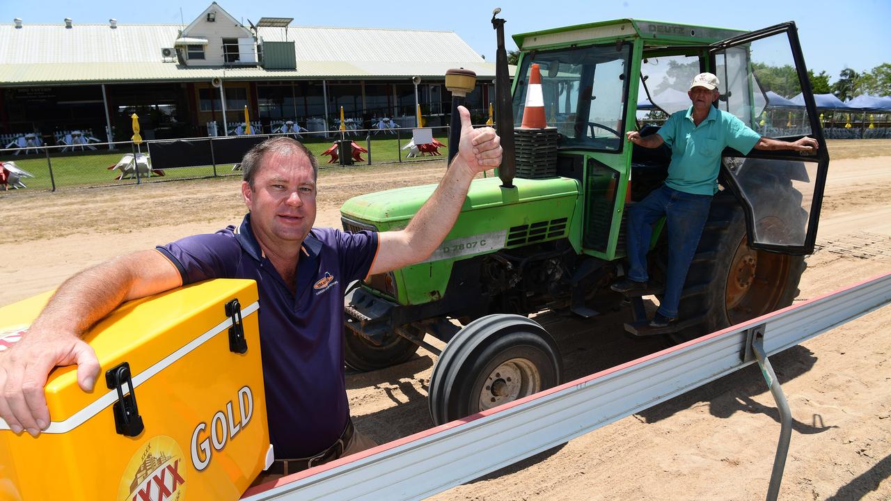 Race club volunteers Dale Rethamel and David Deans ensure the venue is ready for the XXXX Gold Christmas Party Races.