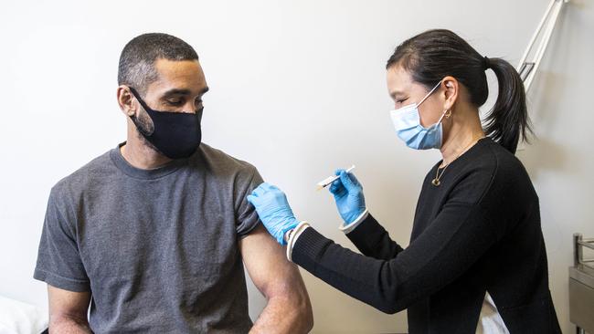 Dr Adrienne Chan administers Callum Silcock’s AstraZeneca vaccination. Picture: Aaron Francis