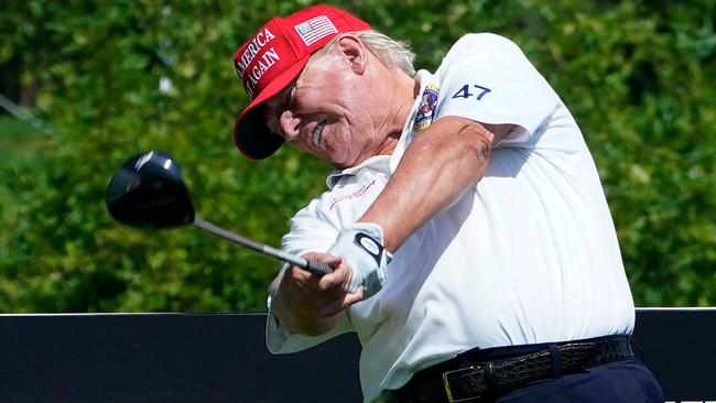 Avid golfer Donald Trump has met Australia’s ambassador to the US Kevin Rudd at the US President-elect’s international golf course in West Palm Beach. Picture: Timothy A Clary / AFP