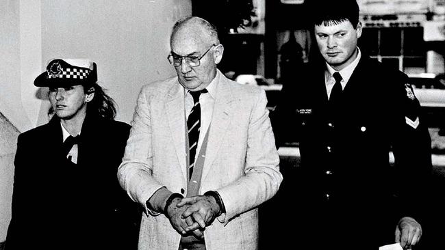 Handcuffed Ridsdale in 1994 aged 60 being led into Melbourne County Court to face charges of sexual abuse of altar boys and other young victims. 