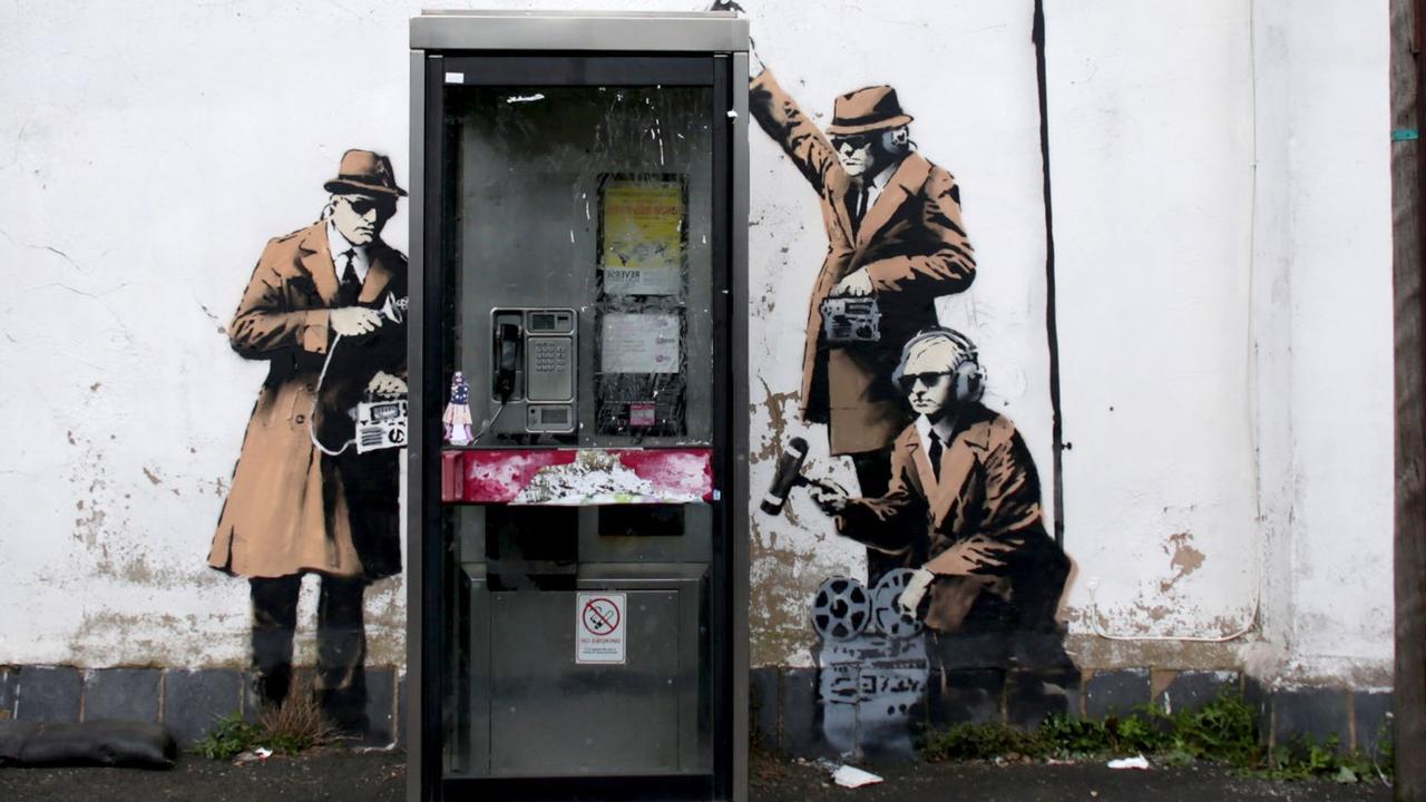 Possible Banksy Artwork Around A Telephone Box