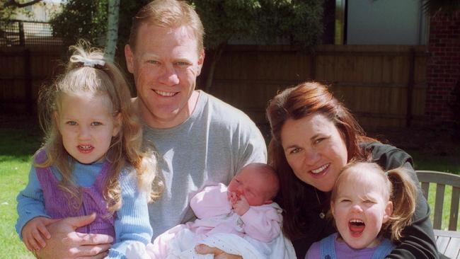 The Burke family in 2002, daughter Ruby, 3, Nathan holding one week old Alice, wife Fiona and Molly, 2.