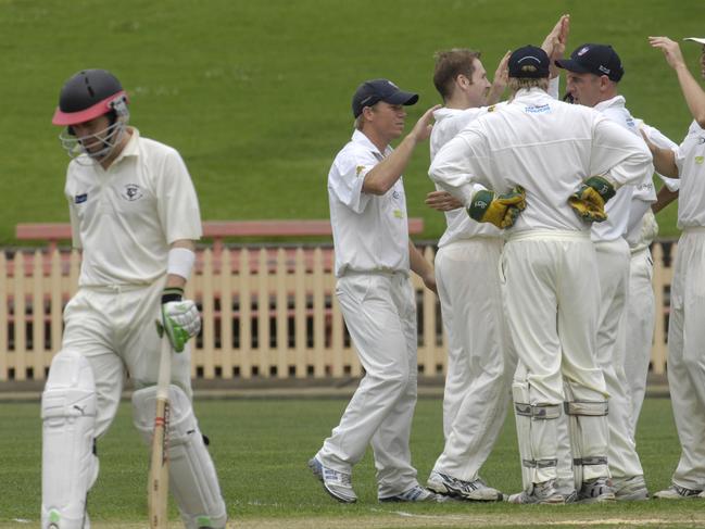 Perry departs North Sydney Oval after being dismissed LBW against Eastern Suburbs, including a young David Warner (far left), in 2007. Picture: John Appleyard.