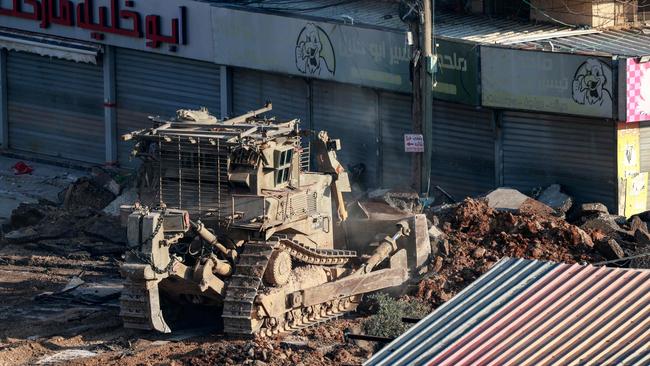 The aid will include armoured bulldozers built by Caterpillar, worth more than US$300m. Picture: AFP.