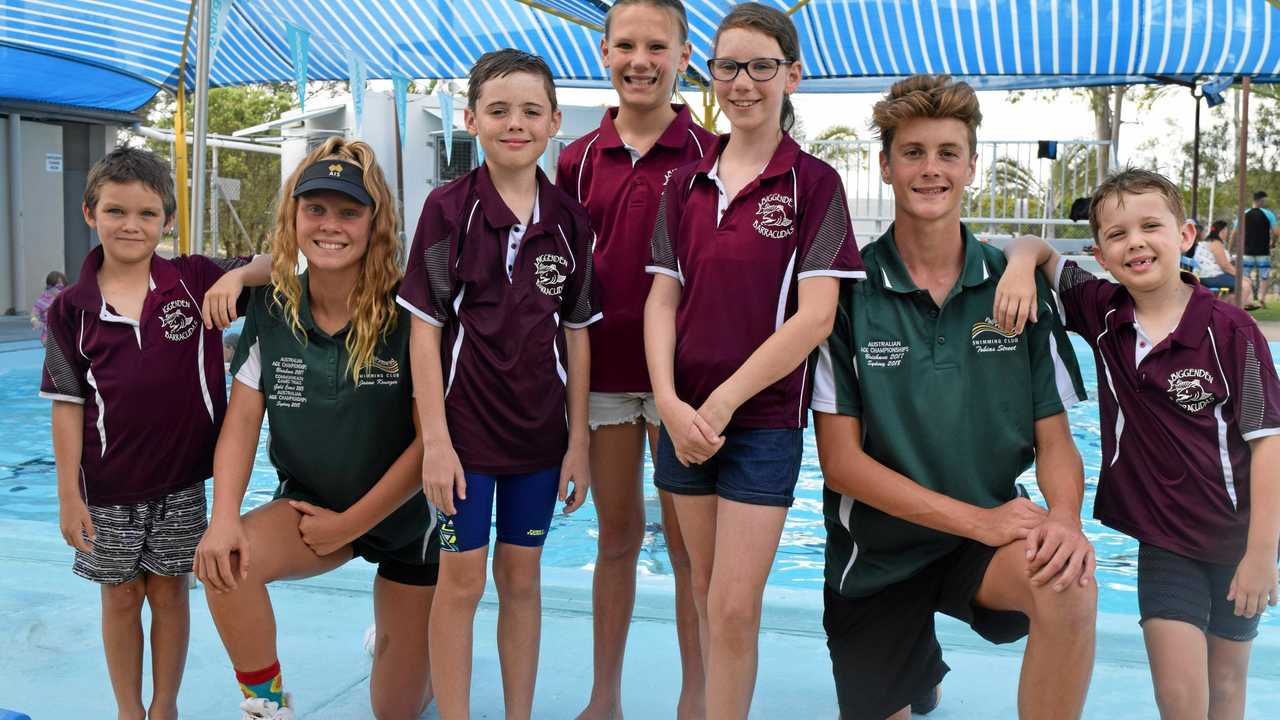 Rubbing shoulders with national swim champions Jaime Krueger and Tobias Street are Biggenden Swimming Club members, Luke Treloar, Lee Richmond, Madeleine and Sophia Radel and Flynn Richmond. Picture: Erica Murree