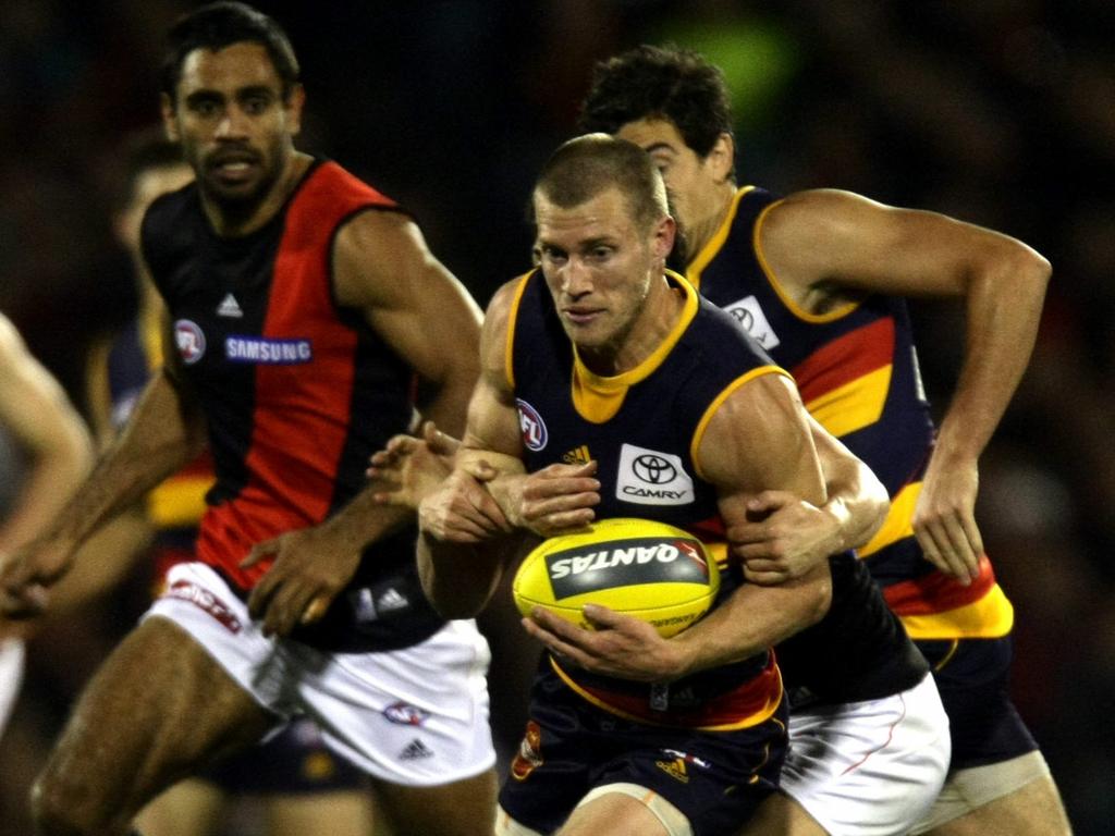 2009 - Thompson takes on the tackler during the elimination final against Essendon. Picture: Morne de Klerk