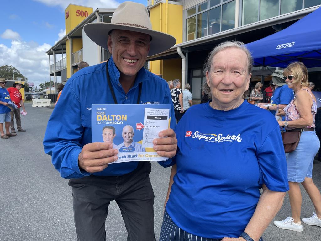 LNP candidate for Mackay Nigel Dalton (left) with a supporter. Early voter polls reflect a potential blue wave for the seat. Photo: Fergus Gregg